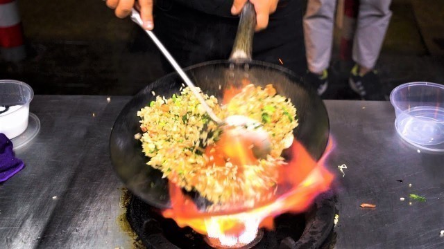 'Chinese Street Food -Fried rice with eggs at Food stall， Lanzhou Hand-Pulled Noodles with Beef'