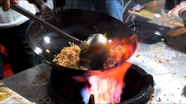 'Chinese Street Food -Night market egg fried rice, kebab, food stall skewers'