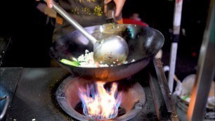 'Chinese Street Food -fried rice with eggs  barbecue rice, traditional craft sugar blowing man-horse'