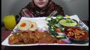 'Eating Spicy Mutton Curry with White Rice, Fried Spinach and Salad - Indian Food'