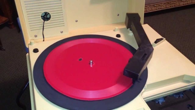 'Cutting Another \"vinyl\" Record on a Solo Plastic Food Plate Red'